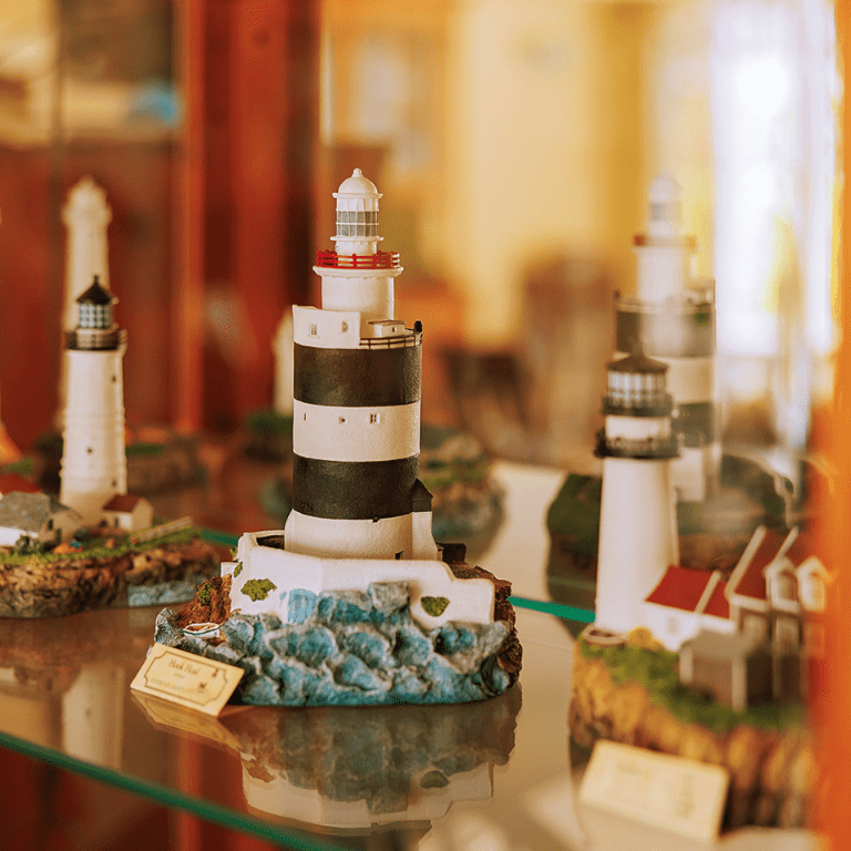 a group of lighthouses on a glass table