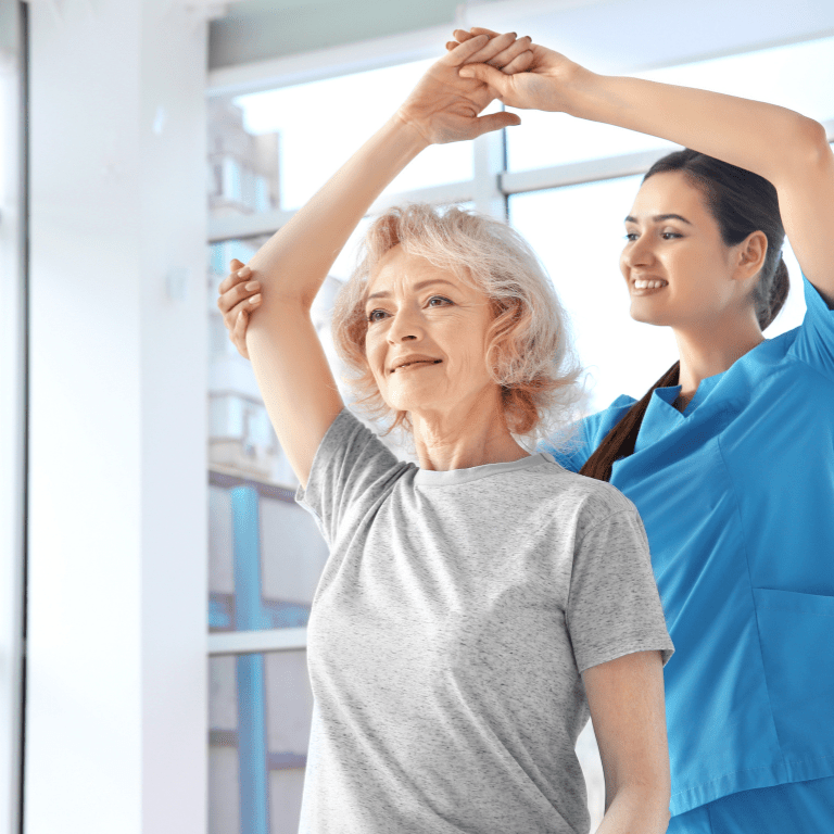 a woman holding her hands up with a nurse