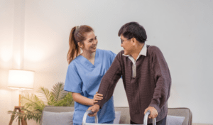 a woman helping a man with a walker