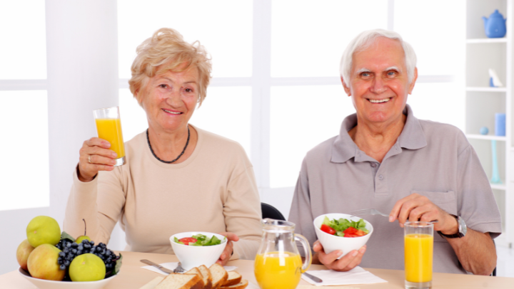 old couple with food.
