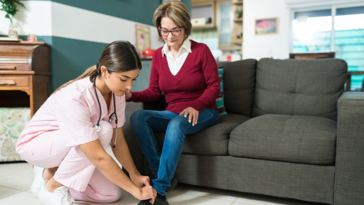 caregiver helping an old lady