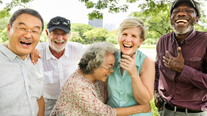 a group of seniors laughing each other 