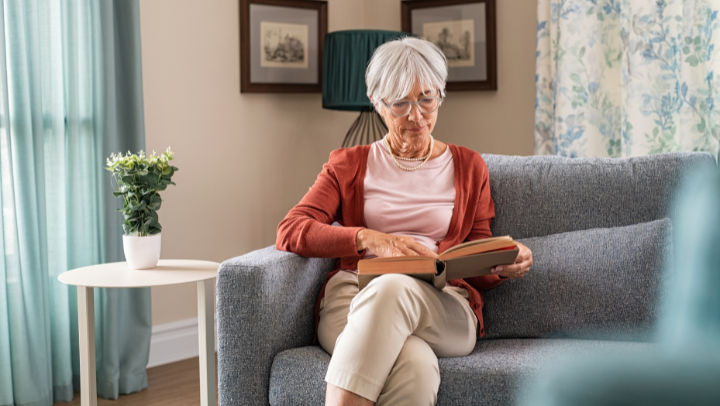an old lady reading a book