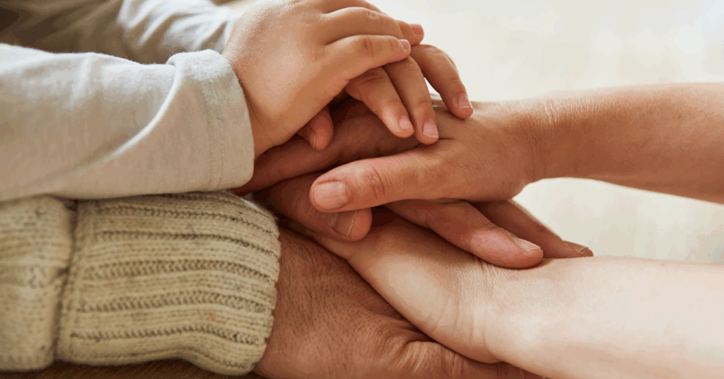hands together of people from different generations