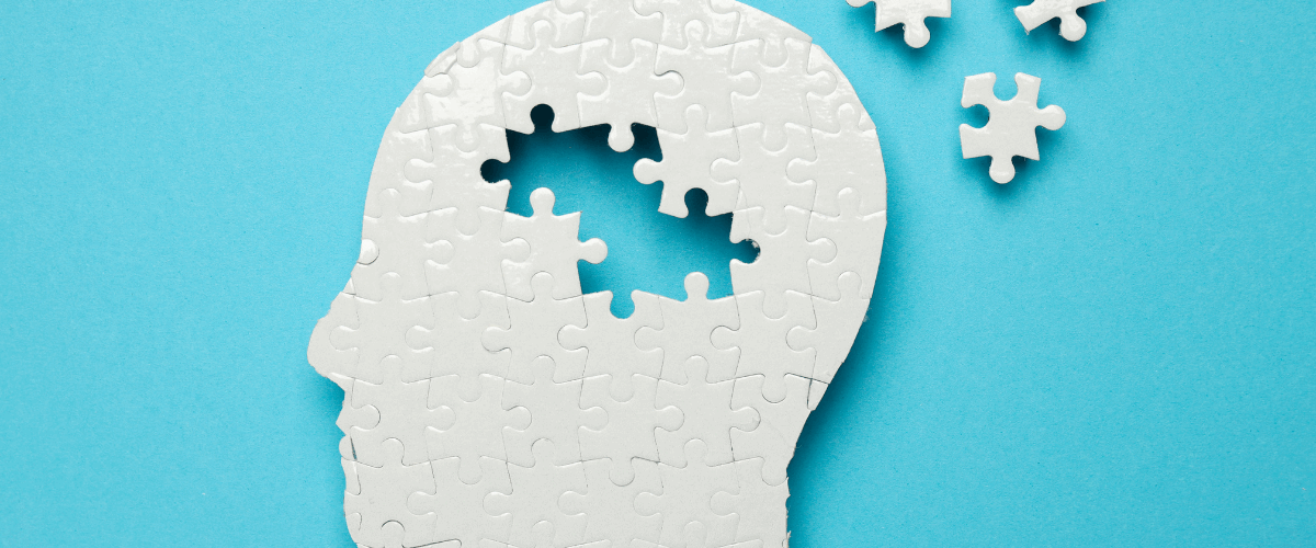 a puzzle of a head with pieces coming off it