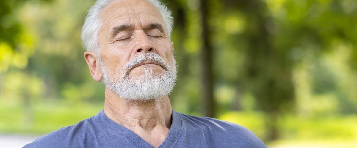 man taking a deep breath