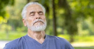 man taking a deep breath