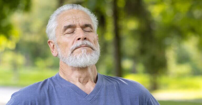 man taking a deep breath