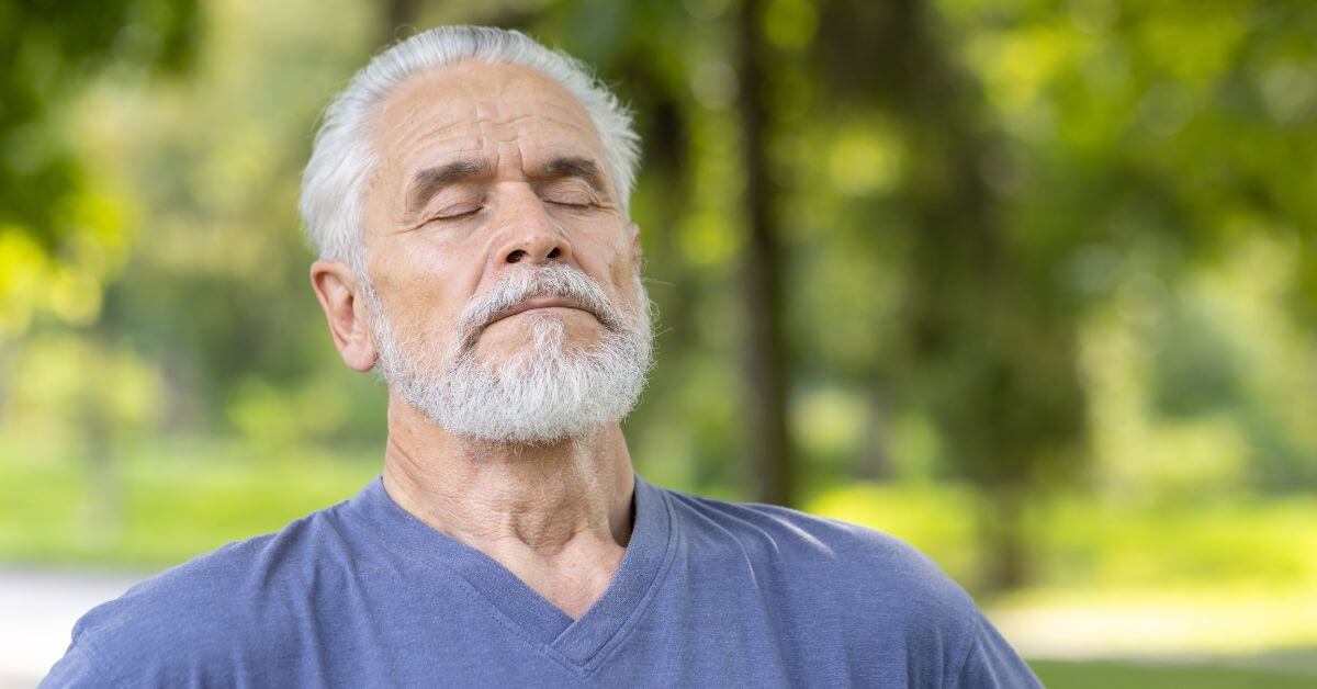 man taking a deep breath