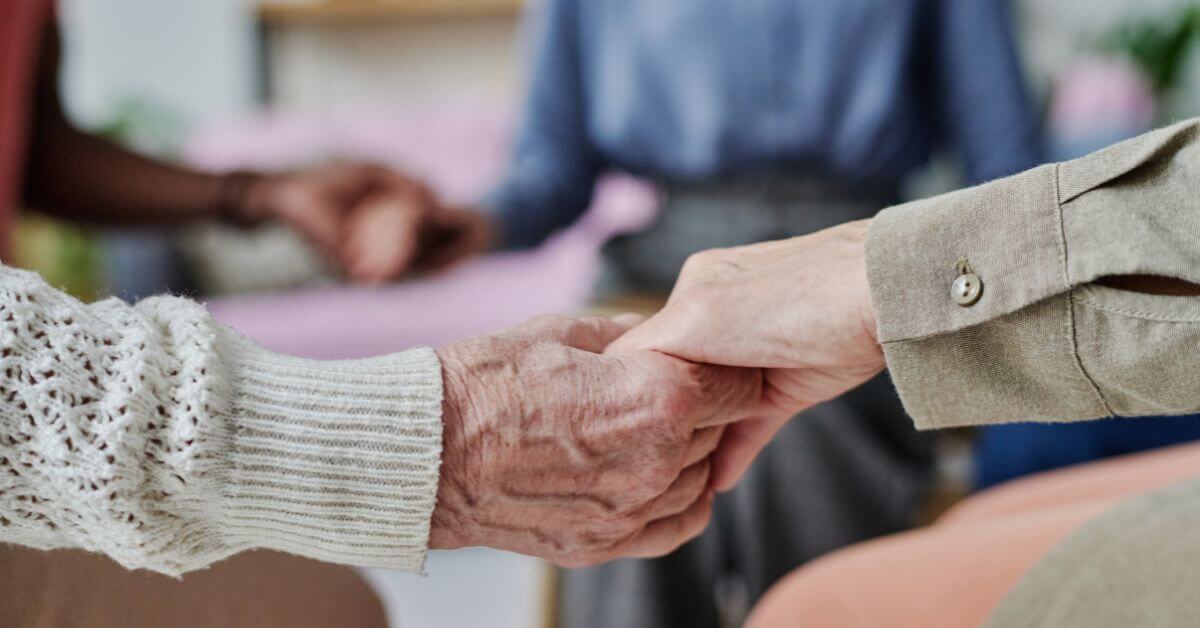 senior hands in best assisted living community